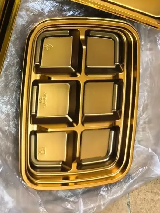 Gold thermoformed tray with six compartments, top view